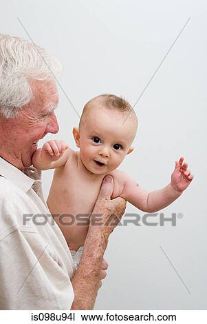 Stock Image - Grandfather with baby grandson. Fotosearch