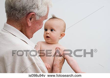 Grandfather with baby grandson View Large Photo Image Stock Photo - Grandfather with baby grandson. Fotosearch