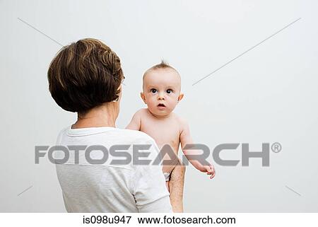 Grandmother holding her grandson View Large Photo Image Stock Photo - Grandmother holding her grandson. Fotosearch