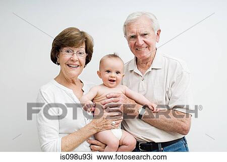 Stock Image - Grandparents with baby grandson. Fotosearch