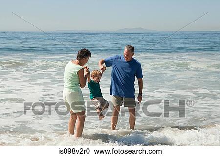 Grandparents with grandson on vacation View Large Photo Image Stock Image - Grandparents with grandson on vacation. Fotosearch