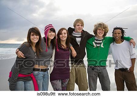 Stock Photograph - Group of young friends, portrait. Fotosearch