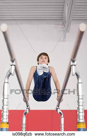 Gymnast on parallel bars View Large Photo Image Stock Image - Gymnast on parallel bars. Fotosearch