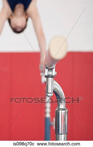 Gymnast on parallel bars View Large Photo Image Stock Image - Gymnast on parallel bars. Fotosearch