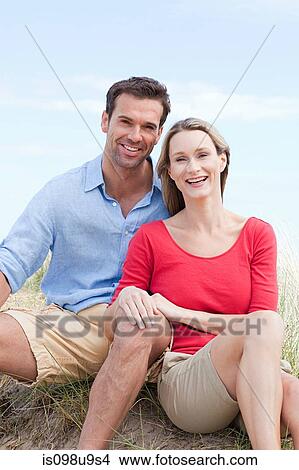 Picture - Happy couple at the coast. Fotosearch