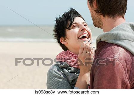 Stock Photo - Happy couple at the coast. Fotosearch
