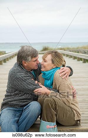 Stock Photography - Happy couple at the coast. Fotosearch