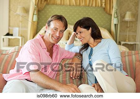 Stock Image - Happy couple in hotel room. Fotosearch