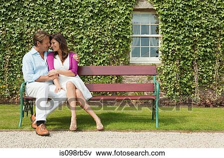 Happy couple on bench View Large Photo Image Stock Photo - Happy couple on bench. Fotosearch