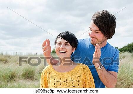 Stock Photography - Happy couple outdoors. Fotosearch