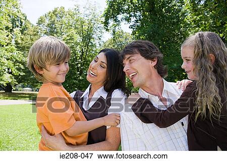 Happy family in park View Large Photo Image Stock Photo - Happy family in park. Fotosearch