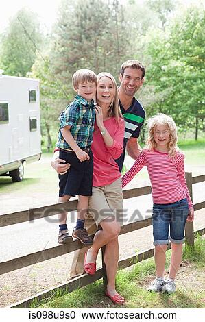 Happy family on caravan holiday View Large Photo Image Stock Image - Happy family on caravan holiday. Fotosearch