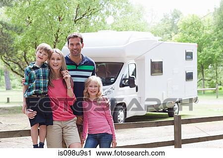 Stock Image - Happy family on caravan holiday. Fotosearch