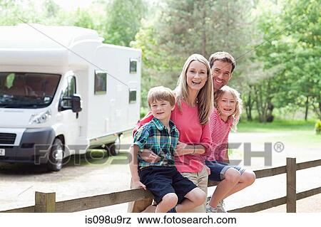 Happy family on caravan holiday View Large Photo Image Stock Photo - Happy family on caravan holiday. Fotosearch