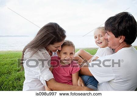 Happy family outdoors View Large Photo Image Stock Photo - Happy family outdoors. Fotosearch