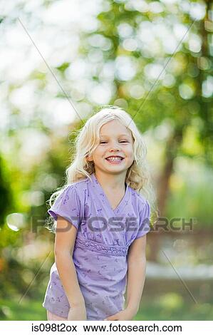 Stock Photo - Happy girl in garden. Fotosearch