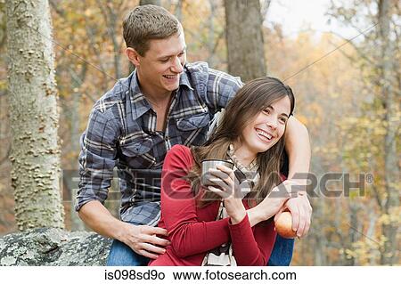 Picture - Happy young couple in forest. Fotosearch