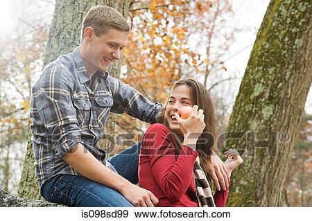 Happy young couple in forest View Large Photo Image Stock Photo - Happy young couple in forest. Fotosearch