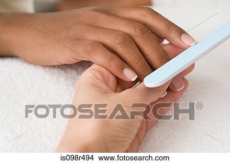 Having a manicure View Large Photo Image Picture - Having a manicure. Fotosearch