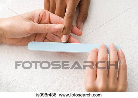 Having a manicure View Large Photo Image Stock Photograph - Having a manicure. Fotosearch