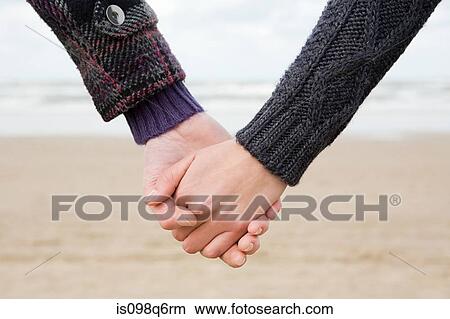 Holding hands View Large Photo Image Picture - Holding hands. Fotosearch