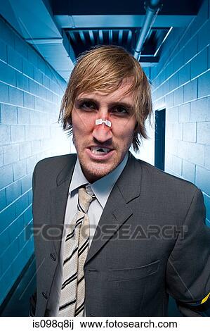 Stock Image - Hostile businessman with a broken nose. Fotosearch