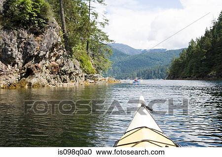 Stock Image - Kayaking in fjord. Fotosearch