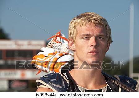 Lacrosse player with lacrosse stick View Large Photo Image Stock Photograph - Lacrosse player with lacrosse stick. Fotosearch