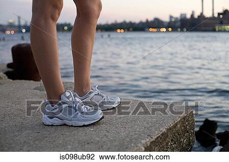 Legs and shoes of runner by river View Large Photo Image Stock Image - Legs and shoes of runner by river. Fotosearch