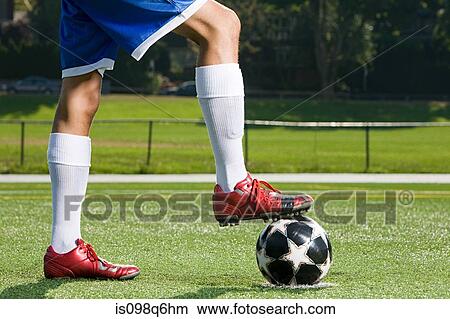 Legs of a footballer and football View Large Photo Image Picture - Legs of a footballer and football. Fotosearch
