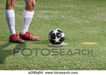 Legs of a footballer and football View Large Photo Image Stock Image - Legs of a footballer and football. Fotosearch
