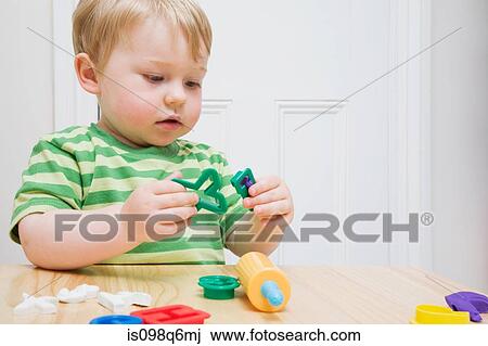 Stock Image - Little boy with toys. Fotosearch