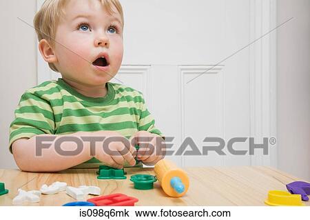 Little boy with toys View Large Photo Image Stock Image - Little boy with toys. Fotosearch
