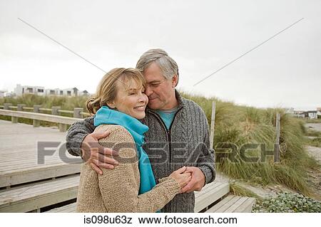 Loving couple at the coast View Large Photo Image Stock Photo - Loving couple at the coast. Fotosearch