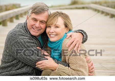 Loving couple at the coast View Large Photo Image Stock Photograph - Loving couple at the coast. Fotosearch