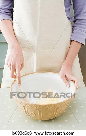 Stock Image - Making a cake. Fotosearch