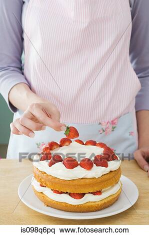 Making a cake with strawberries View Large Photo Image Stock Photography - Making a cake with strawberries. Fotosearch