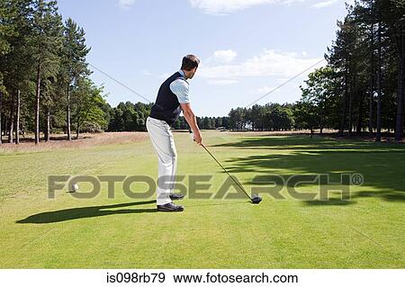 Stock Photo - Male golfer on the fairway. Fotosearch