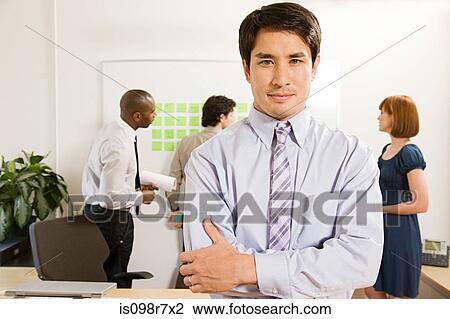 Stock Image - Male office worker and colleagues. Fotosearch