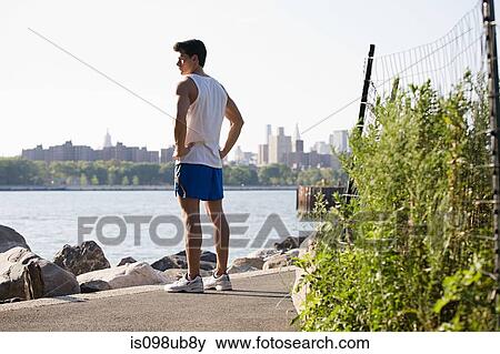 Male runner by river View Large Photo Image Stock Photo - Male runner by river. Fotosearch