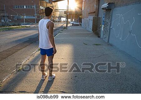 Male runner on urban street View Large Photo Image Stock Photo - Male runner on urban street. Fotosearch