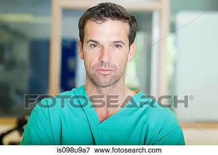 Male surgeon looking serious View Large Photo Image Stock Photo - Male surgeon looking serious. Fotosearch