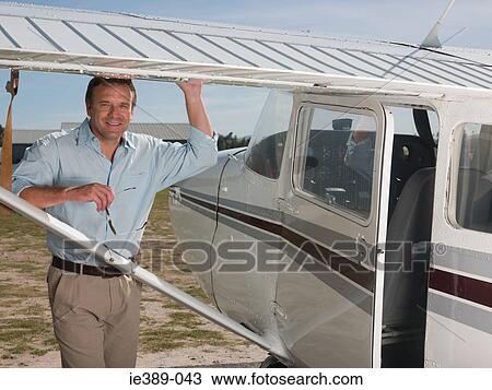 Man by private aeroplane View Large Photo Image Stock Image - Man by private aeroplane. Fotosearch