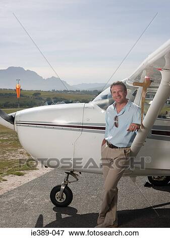 Stock Photo - Man by private aeroplane. Fotosearch