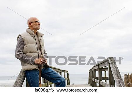 Stock Photography - Man by the sea. Fotosearch