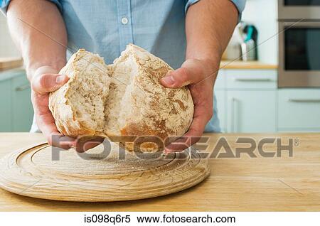 Man holding bread View Large Photo Image Stock Photography - Man holding bread. Fotosearch