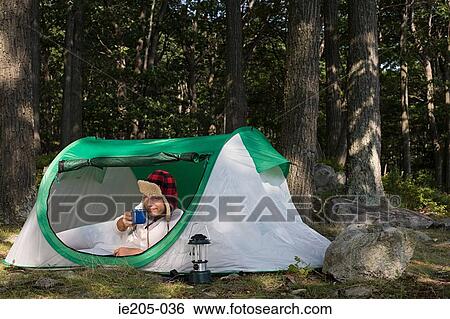 Man in a tent View Large Photo Image Stock Photograph - Man in a tent. Fotosearch