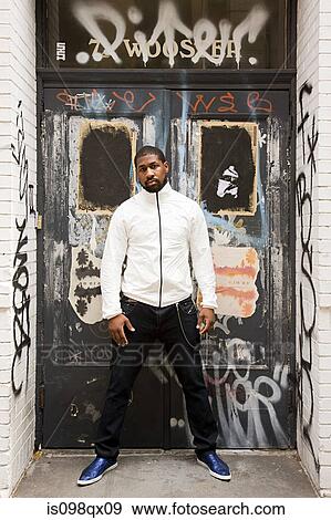 Stock Photo - Man in city doorway. Fotosearch