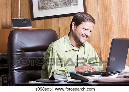 Stock Image - Man in office. Fotosearch