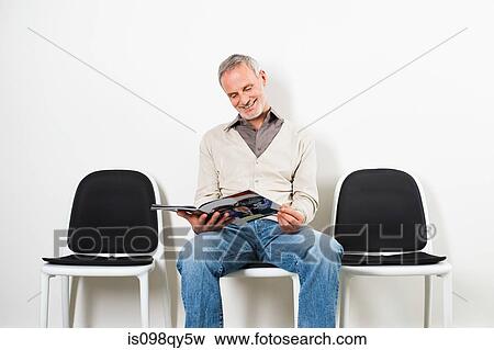 Man in waiting room View Large Photo Image Stock Photo - Man in waiting room. Fotosearch